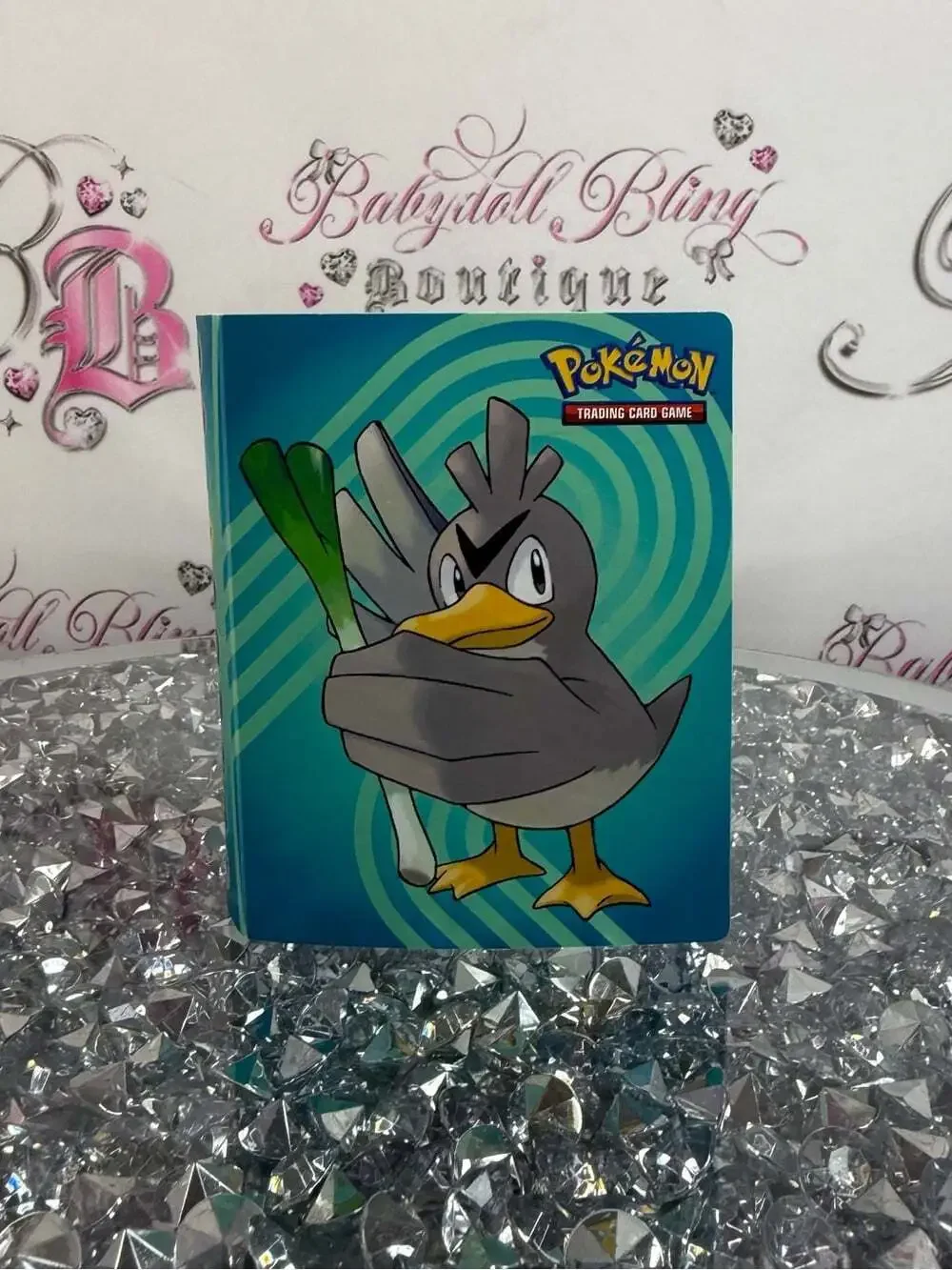 Pokemon trading card book Gray Duck Card Binder with Teal/Blue Swirl Background